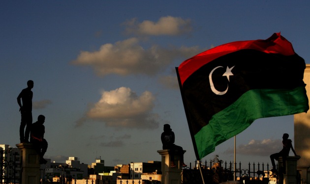 Libyans watch a protest against Ansar al-Shariah Brigades and other Islamic militias, in Benghazi, September 2012. (AP Photo/Mohammad Hannon)